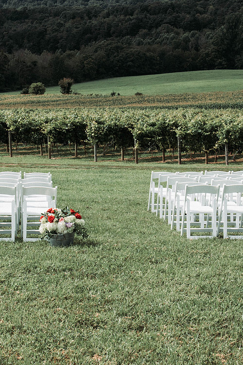 Image of Ceremony with White Padded chairs