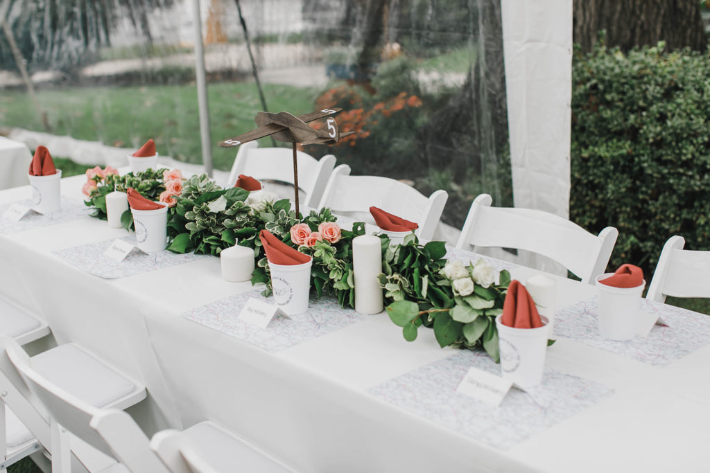 Image of Head Table with White Padded Chairs