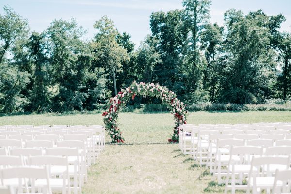 image of wedding ceremony set with white folding padded chair rentals