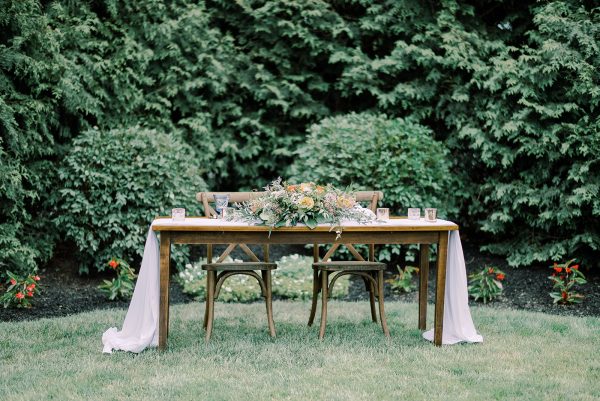 image of sweetheart table with cross back chair rentals