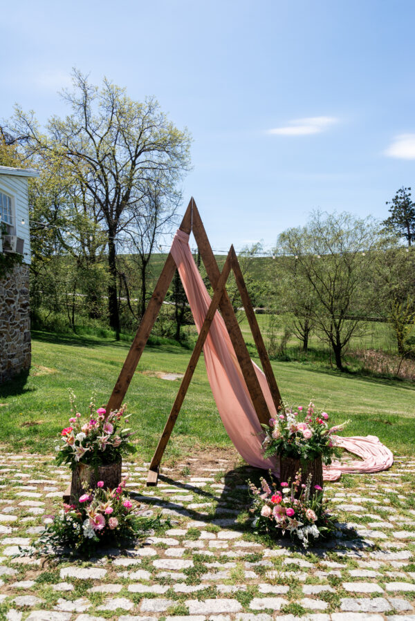 image of double triangle wedding arch rental