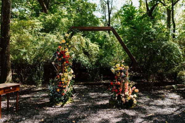 wooden geometric wedding arch