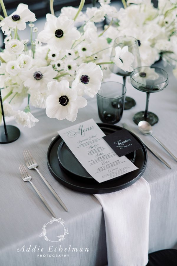 image of black plate rental with silver flatware