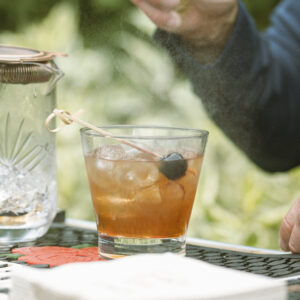 image of rocks glass rental with bartender preparing a drink