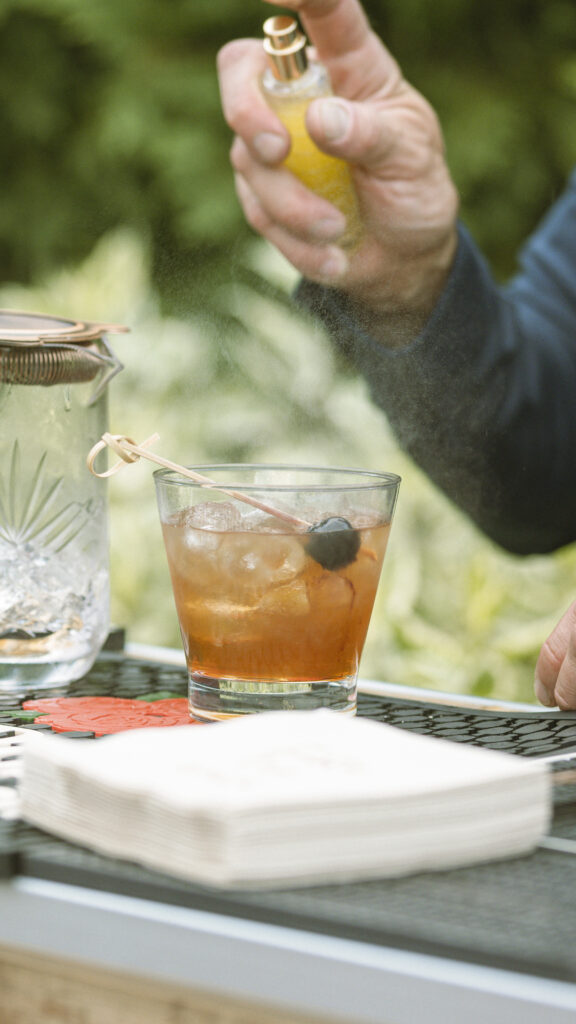 image of rocks glass rental with bartender preparing a drink