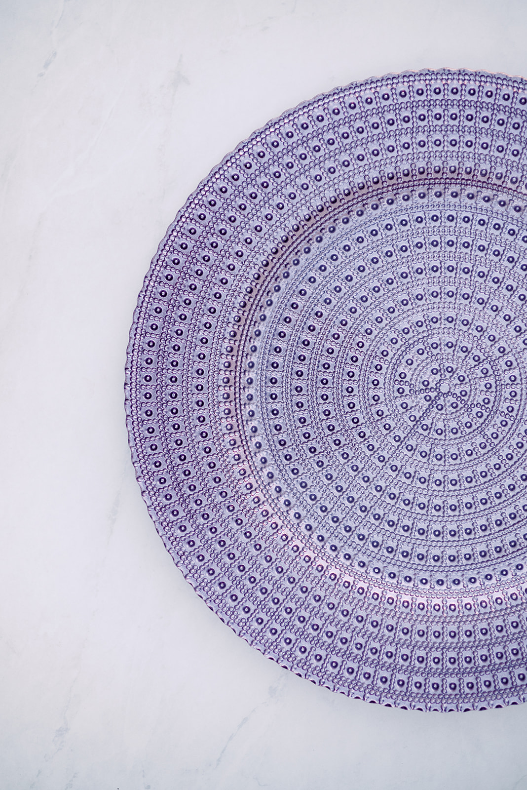 Image of purple beaded charger rental