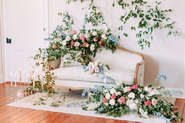 image of Charlotte French country sofa rental with flowers