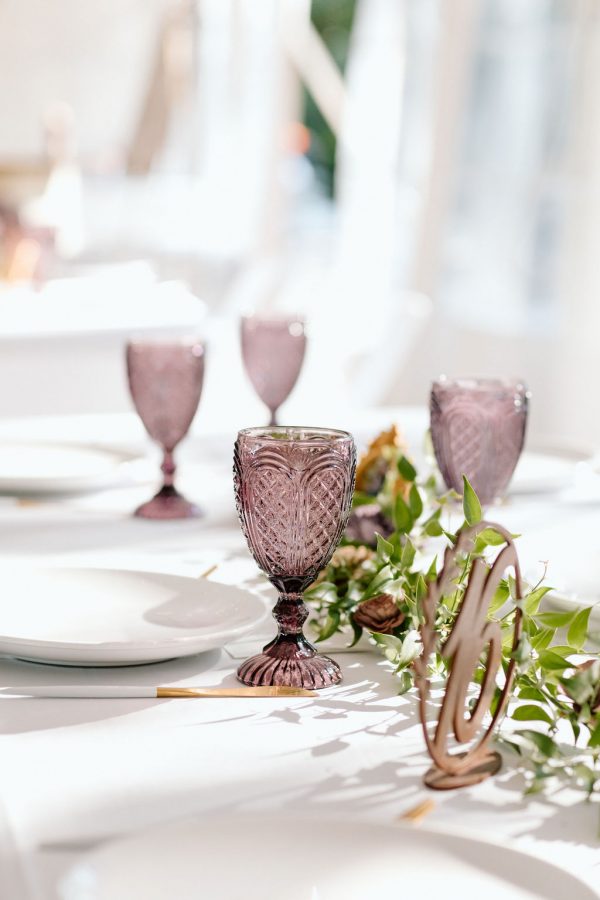 image of purple goblet rentals on table