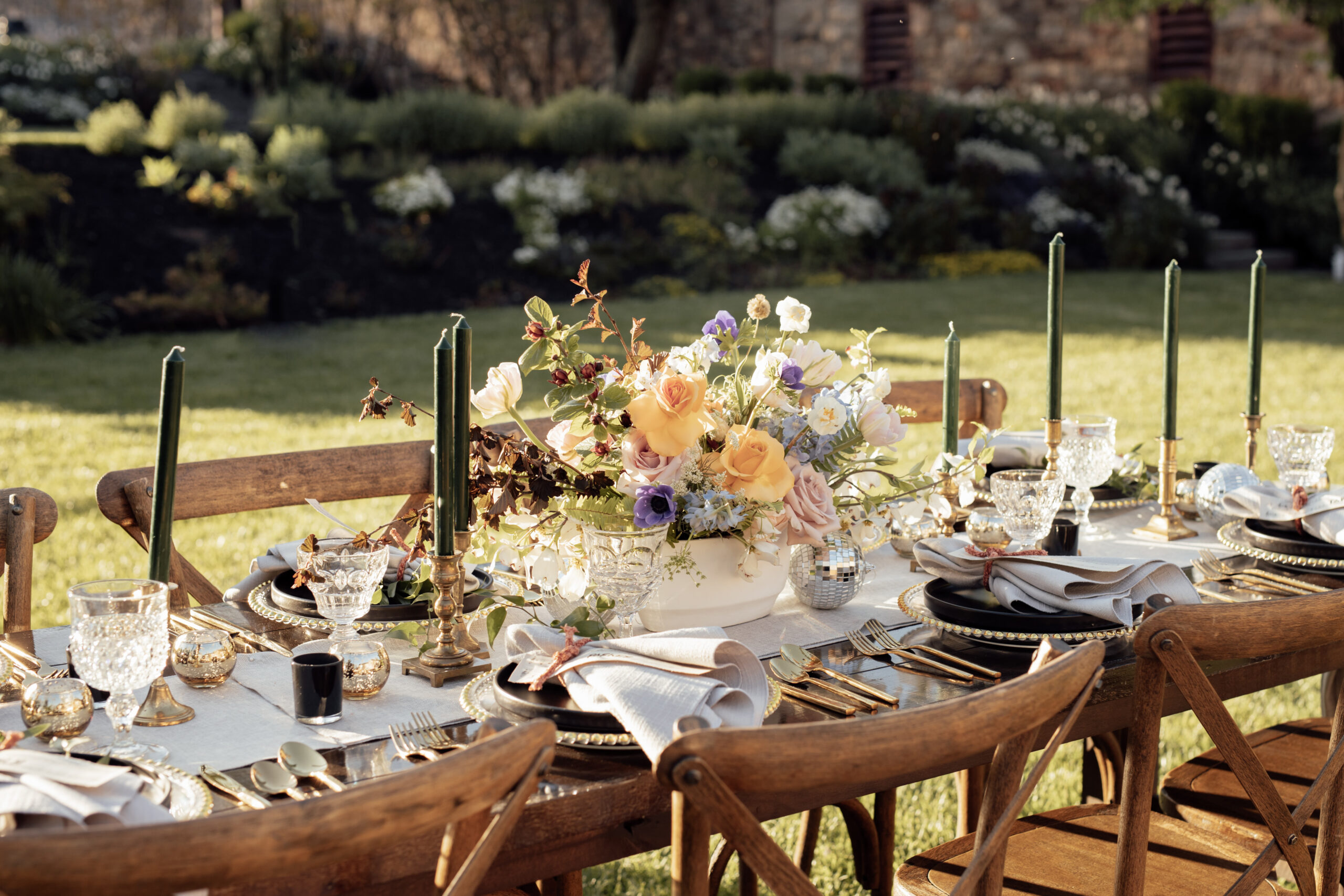 Image of farmhouse tables and crossback chair rentals with tabletop setup