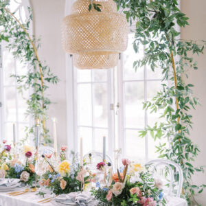 image of rattan chandelier rental over table