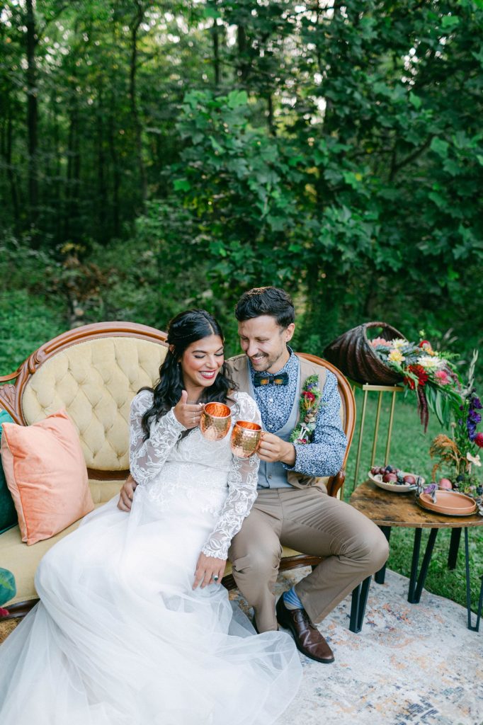 image of couple sitting on mustard yellow sofa rental