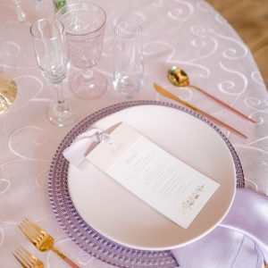 Image of pink and purple dinnerware rental package