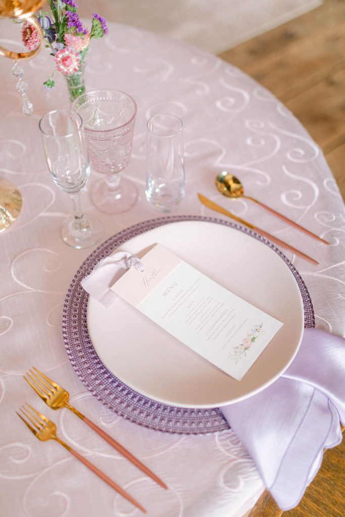 Image of pink and purple dinnerware rental package