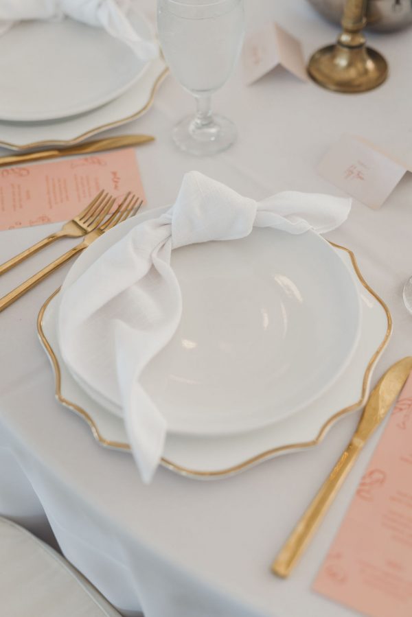 image of gold and white dinnerware rental package