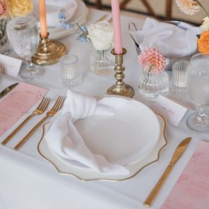 Image of gold and white dinnerware rental package