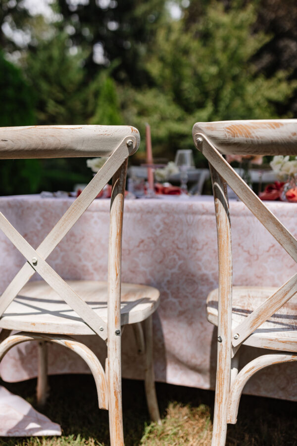 closeup of limewash cross back chair rental in PA