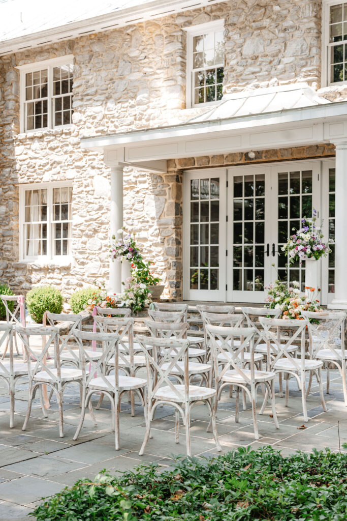 image of cross back chair rentals set for ceremony