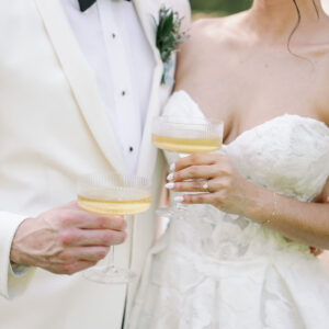 image of fluted champagne coupe rentals with bride and groom