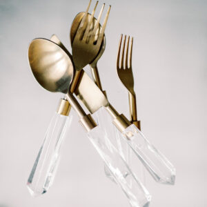 image of gold and clear lucite flatware