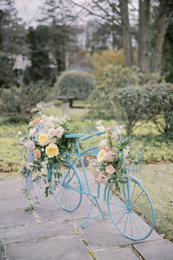 Image of blue bike rental with flowers