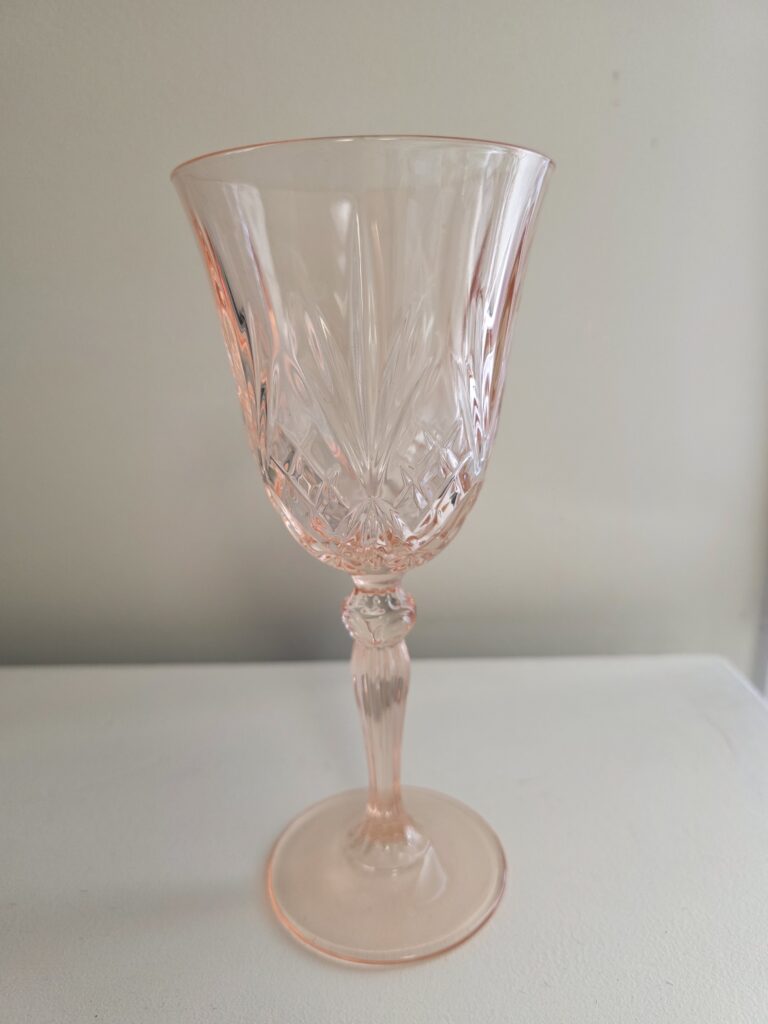 image of pink cut glass wine glass