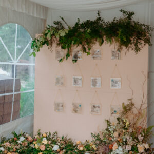 image of pink seating display wall rental with hooks set for reception