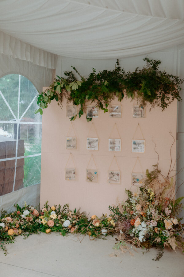 image of pink seating display wall rental with hooks set for reception