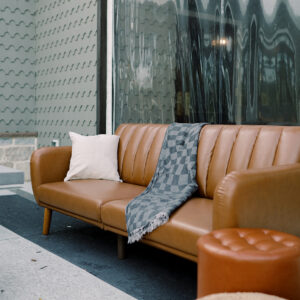 Image of brown leather sofa rental staged for events