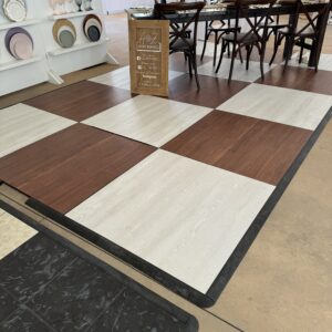 image of whitewashed floor with dark mable checkboard dance floor installed