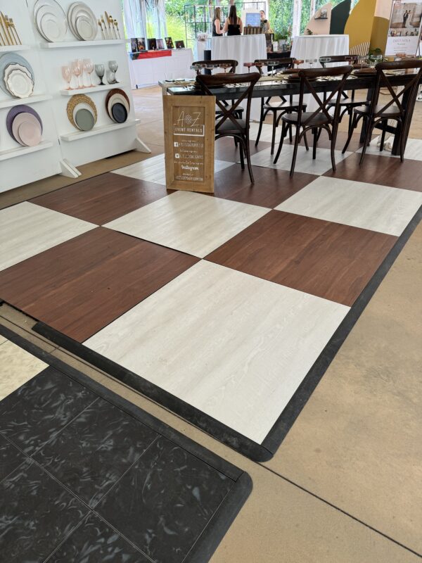 image of whitewashed floor with dark mable checkboard dance floor installed