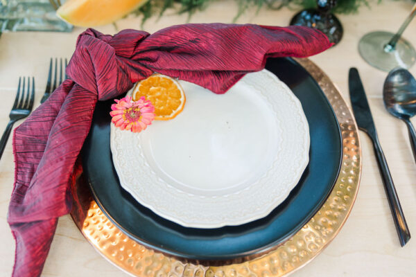 image of black and copper dinnerware rentals