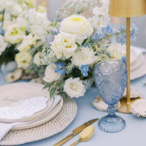 image of costal themed wedding dinnerware package with rattan charger rental