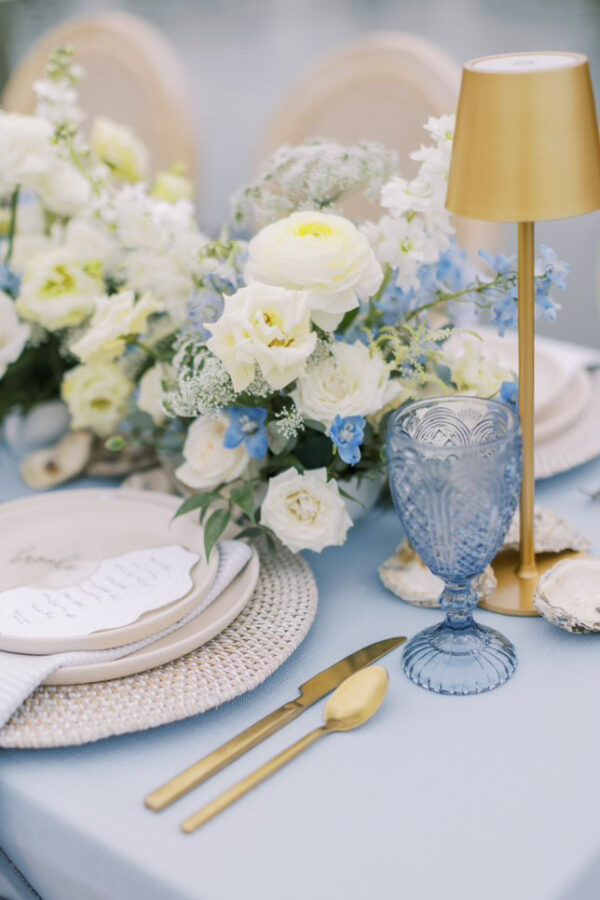 image of costal themed wedding dinnerware package with rattan charger rental