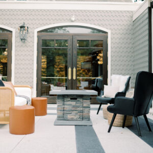 Image of Black and White mid century lounge rental with fire pit set for wedding