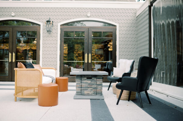 Image of Black and White mid century lounge rental with fire pit set for wedding