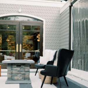 image of black leather lounge chair in a cocktail hour lounge rental