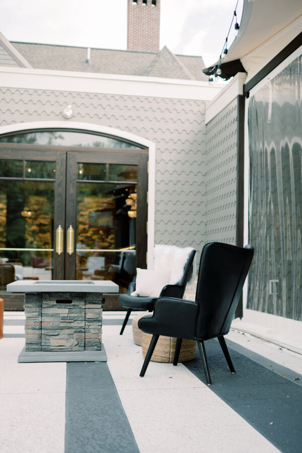 image of black leather lounge chair in a cocktail hour lounge rental