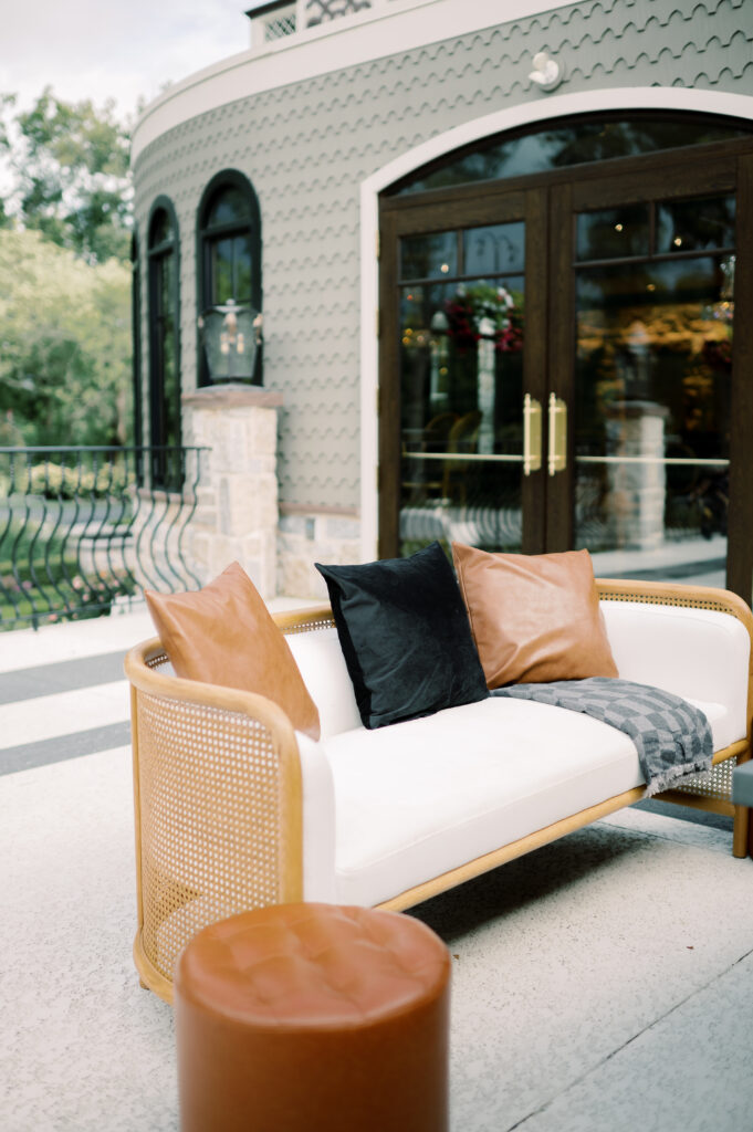 image of white loveseat staged for wedding lounge
