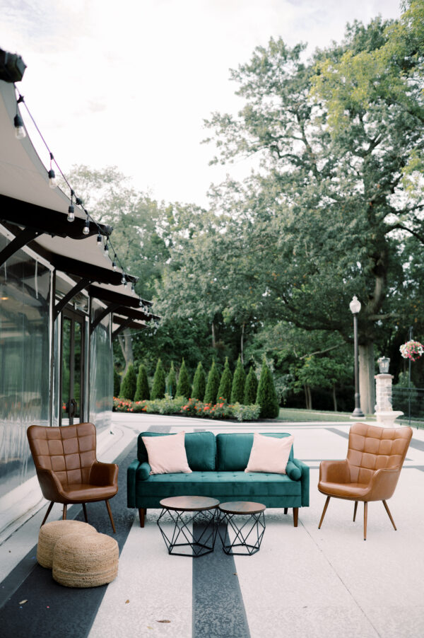 image of green and leather lounge rental set for a wedding