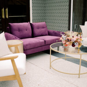 image of gold circle coffee table rental staged in an event lounge