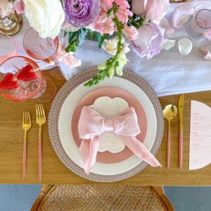 image of pink dinnerware rental package with flowers