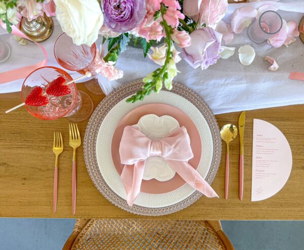 image of pink dinnerware rental package with flowers