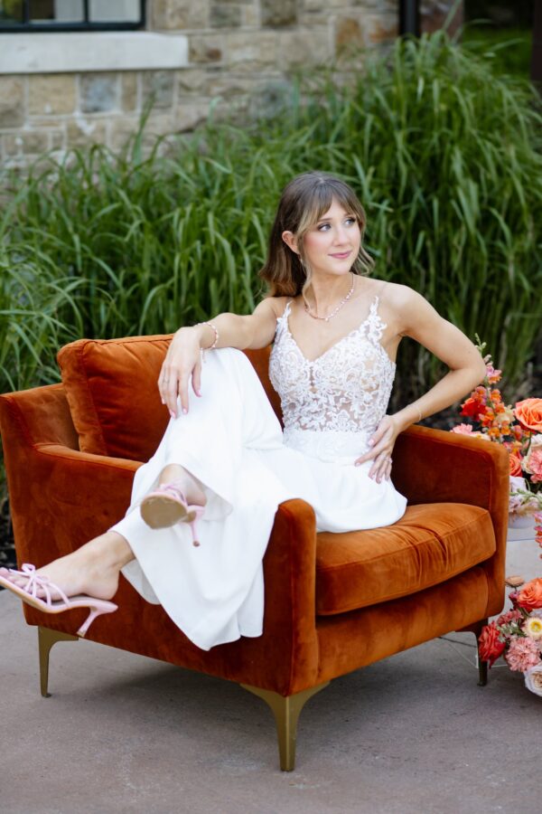 image of Bride on Remi orange lounge chair rental