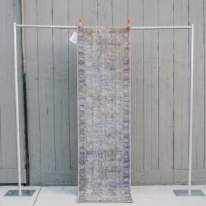 image of Andrea Rug runner rental staged against a wooden wall