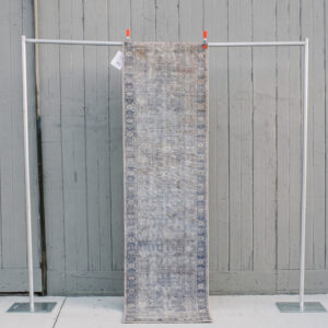 image of Andrea Rug runner rental staged against a wooden wall