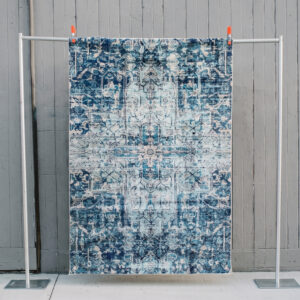 image of Sylas rug staged against a wooden wall