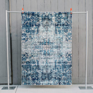 image of Sylas rug staged against a wooden wall