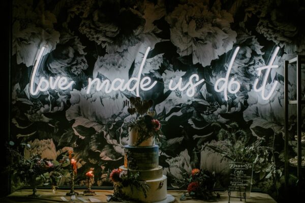 image of love made us do it neon sign rental