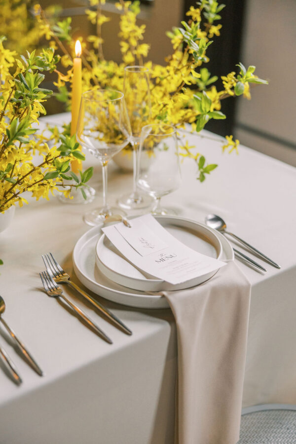 image of clean white dinnerware setting at a wedding