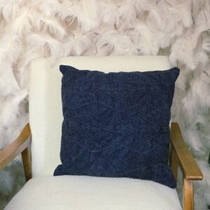 Navy blue pillow with subtle geometric stitching